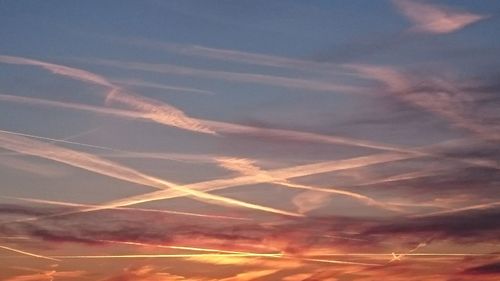 Scenic view of mountains against sky at sunset