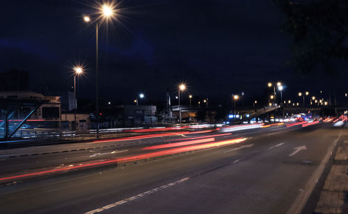 Light trails on city street at night