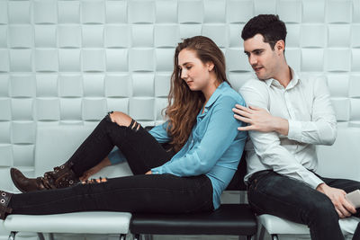 Young couple looking at camera