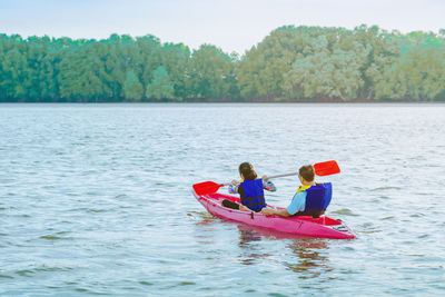 People in boat on water