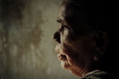 Close-up of senior woman at home