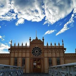 Low angle view of building against blue sky
