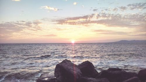 Scenic view of sea at sunset