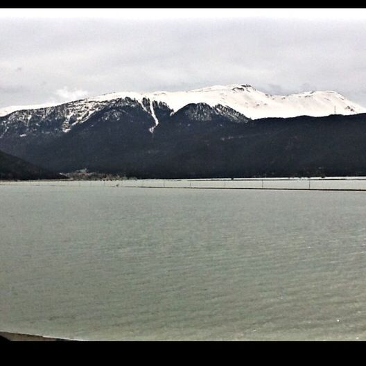 mountain, snow, cold temperature, winter, mountain range, tranquil scene, scenics, tranquility, season, snowcapped mountain, sky, beauty in nature, water, lake, weather, nature, cloud - sky, frozen, landscape, waterfront