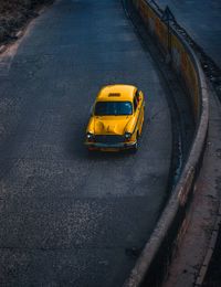 High angle view of yellow car on street