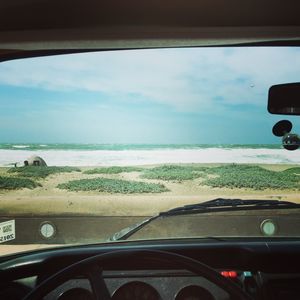 Cropped image of car on road