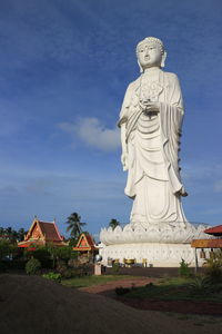 Statue against blue sky