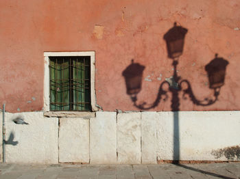 Shadow of window on brick wall