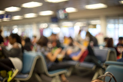People sitting at airport departure area