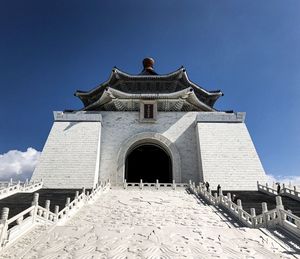 Low angle view of historic building against clear blue sky