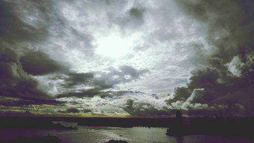 Scenic view of sea against cloudy sky