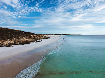 Scenic view of sandy white beach. 