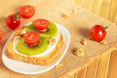 High angle view of fruits in plate on table