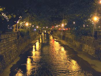 View of illuminated street lights at night