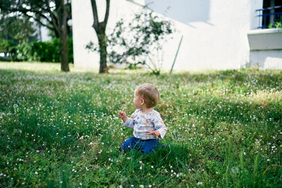 Full length of cute baby girl on field