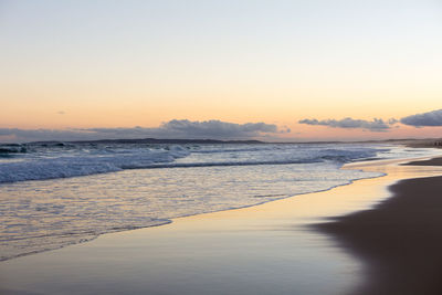 Scenic view of sea against clear sky during sunset