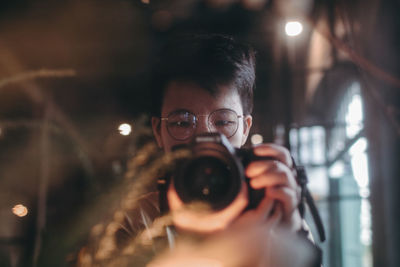 Portrait of man photographing