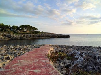 View of calm sea against cloudy sky