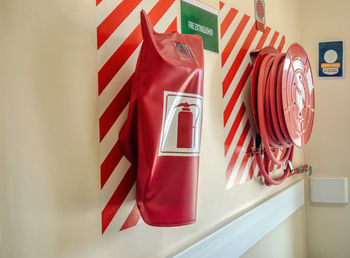 Close-up of flags hanging against wall