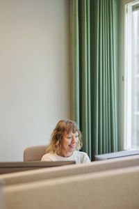 Smiling woman working in office