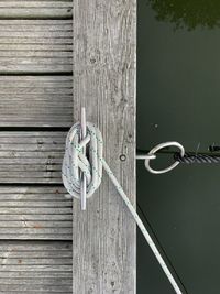 Directly above shot of rope tied to bollard