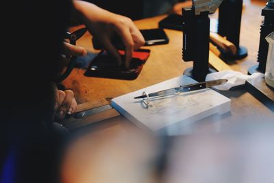 Close-up of man working on table