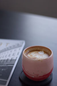 Close-up of coffee cup on table