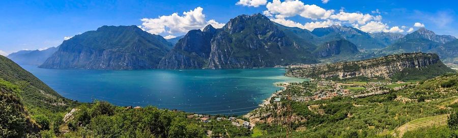 Panoramic view of landscape and mountains against blue sky