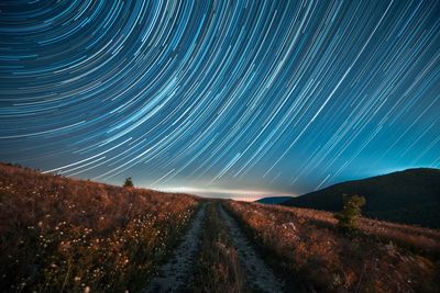 Scenic view of illuminated star field against sky at night