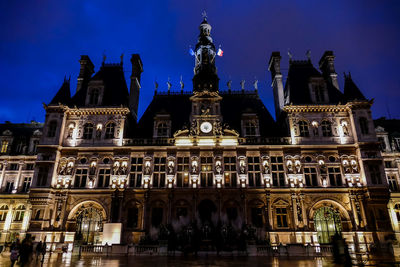 Low angle view of illuminated building at night