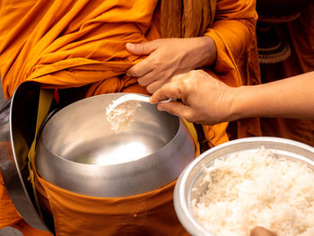 Midsection of woman holding ice cream
