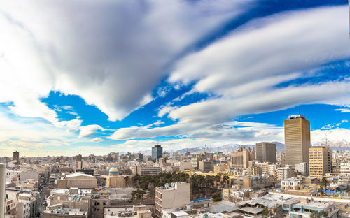 Modern buildings in city against sky