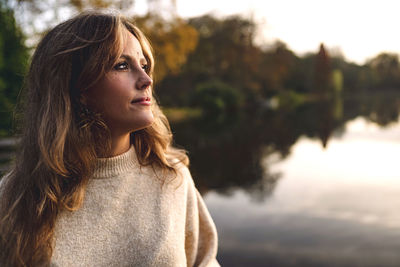 Portrait of young woman in lake