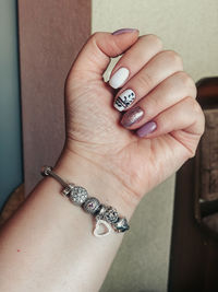 Close-up of woman hand on wall