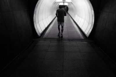 Full length of woman in tunnel