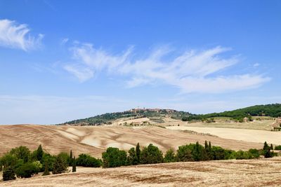 View of landscape against blue sky