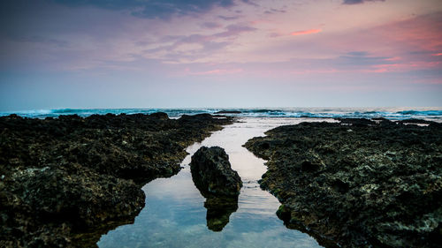 Scenic view of sea against sky at sunset