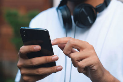 Close-up of man using mobile phone