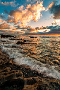 Scenic view of sea against sky during sunset