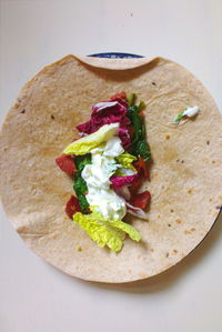 Directly above shot of salad on roti