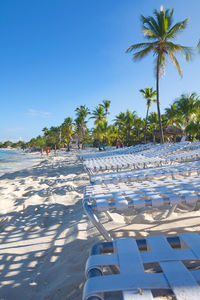 Scenic view of beach against clear blue sky