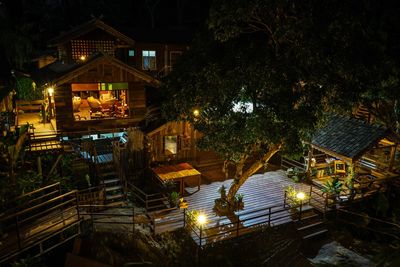 High angle view of illuminated staircase by building at night