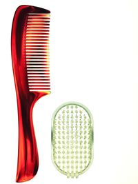 Close-up of colored pencils over white background