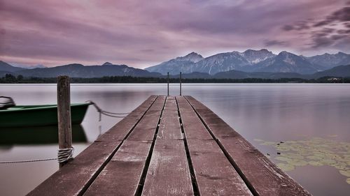 Pier over lake against mountains