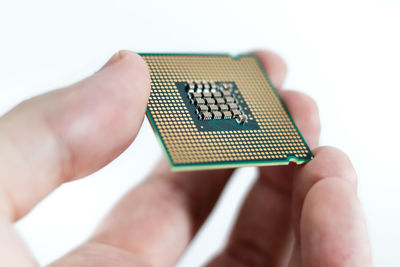 Midsection of man holding camera