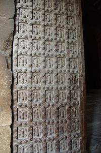 Close-up of carvings on old building in temple