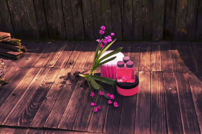 High angle view of pink flower pot on table