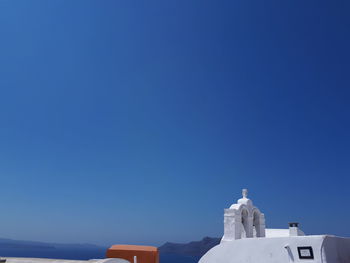 Statue of cathedral against clear blue sky