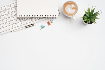Directly above shot of objects on white background