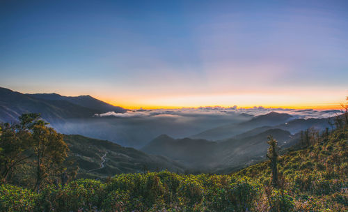 Scenic view of mountains against sky during sunset